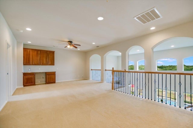 10524 Roy Butler Dr, Austin, TX 78717 - interior space featuring recessed lighting, light carpet, baseboards, and a sink