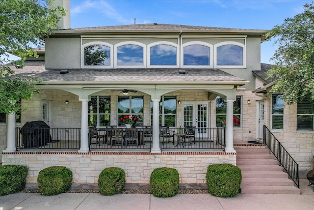 10524 Roy Butler Dr, Austin, TX 78717 - view of front of house featuring stone siding, a porch, and roof with shingles