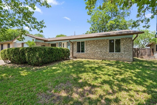1012 Chesapeake Dr, Austin, TX 78758 - view of front of home featuring stone siding and a garage