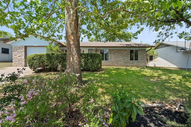 1012 Chesapeake Dr, Austin, TX 78758 - ranch-style home featuring stone siding, a front lawn, and an attached garage