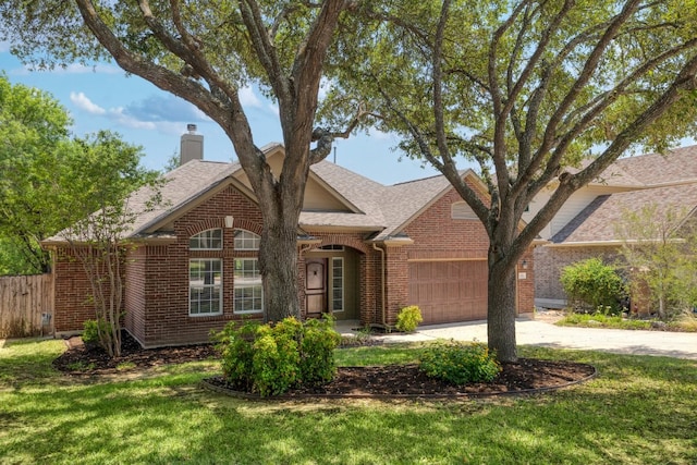 14943 Doria Dr, Austin, TX 78728 - view of front of house featuring brick siding, a garage, driveway, a chimney, and roof with shingles