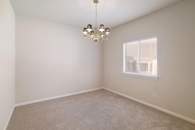 14943 Doria Dr, Austin, TX 78728 - carpeted empty room with a chandelier and baseboards