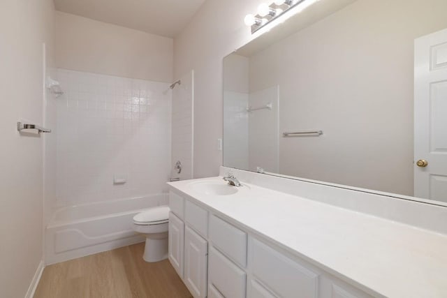 14943 Doria Dr, Austin, TX 78728 - full bathroom with toilet, wood finished floors, vanity, and tub / shower combination