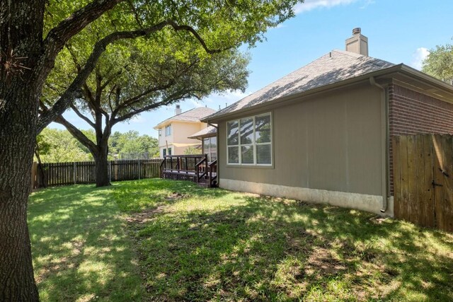 14943 Doria Dr, Austin, TX 78728 - view of yard with a deck