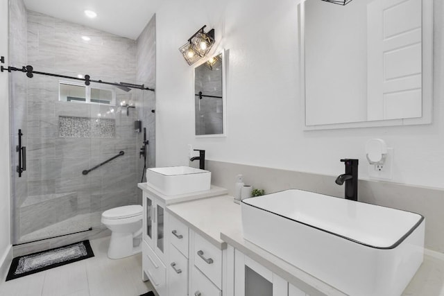 123 Zacate St, Elgin, TX 78621 - full bathroom featuring a shower stall, double vanity, and recessed lighting