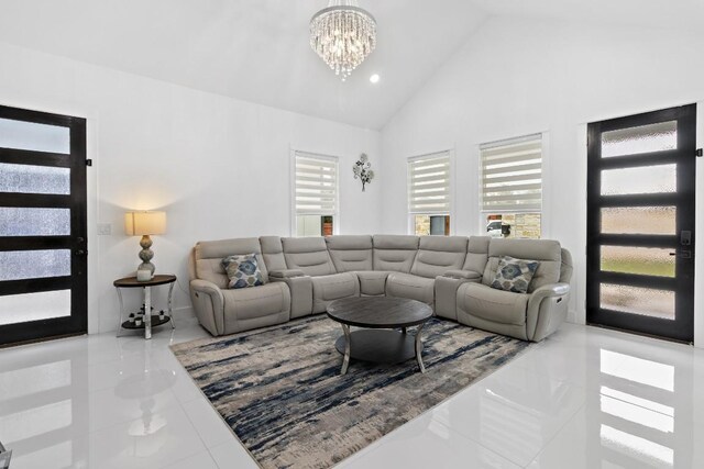 123 Zacate St, Elgin, TX 78621 - tiled living area with a chandelier and high vaulted ceiling