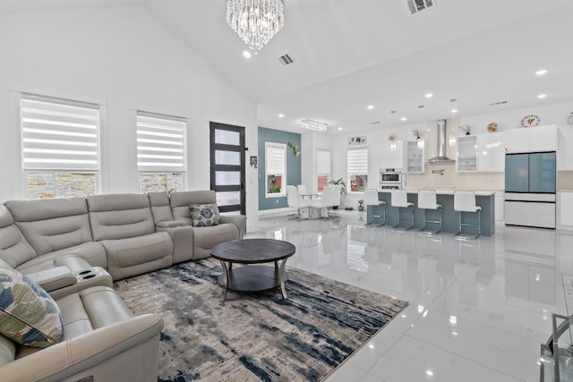 123 Zacate St, Elgin, TX 78621 - living area with a chandelier, light tile patterned flooring, recessed lighting, and high vaulted ceiling