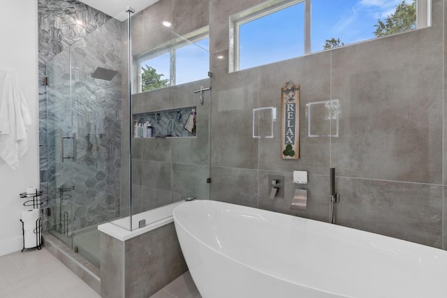 123 Zacate St, Elgin, TX 78621 - full bath featuring a freestanding tub and a shower stall