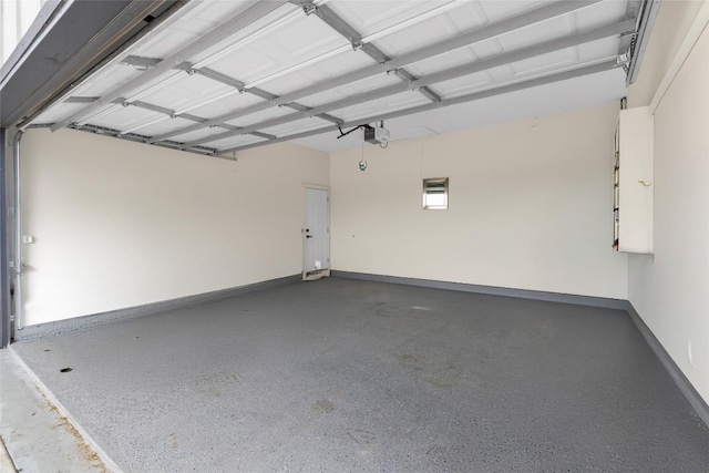 123 Zacate St, Elgin, TX 78621 - garage featuring a garage door opener and baseboards