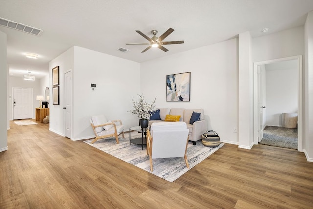 107 Nathaniel Dr, Taylor, TX 76574 - living room with light wood-style flooring, a ceiling fan, and baseboards
