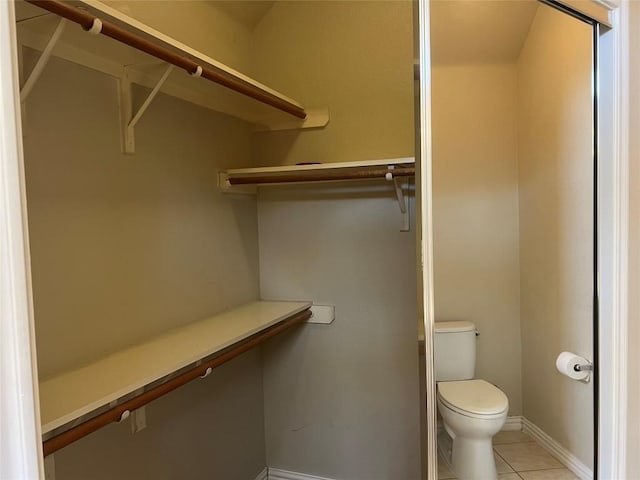 122 Deep Woods Ct, Cedar Creek, TX 78612 - spacious closet featuring light tile patterned floors
