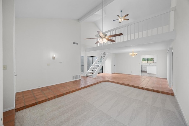 5225 Langwood Dr, Austin, TX 78754 - unfurnished living room featuring ceiling fan, a chandelier, high vaulted ceiling, tile patterned floors, and stairs