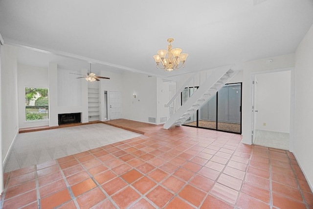 5225 Langwood Dr, Austin, TX 78754 - unfurnished living room with built in features, stairs, a chandelier, ceiling fan, and a fireplace