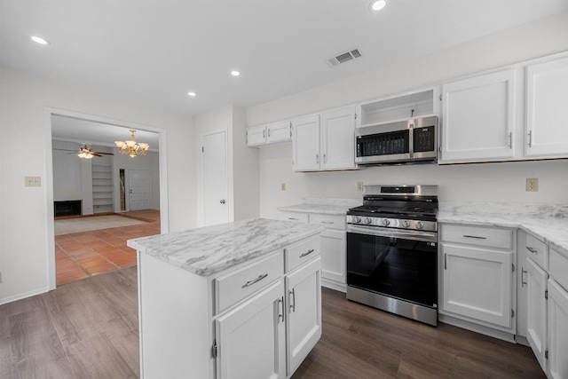 5225 Langwood Dr, Austin, TX 78754 - kitchen featuring appliances with stainless steel finishes, ceiling fan, white cabinets, recessed lighting, and dark wood-type flooring