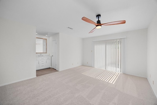 5225 Langwood Dr, Austin, TX 78754 - spare room featuring a ceiling fan, carpet, and baseboards