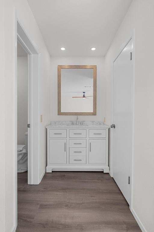 5225 Langwood Dr, Austin, TX 78754 - corridor featuring dark wood finished floors, recessed lighting, a sink, and baseboards