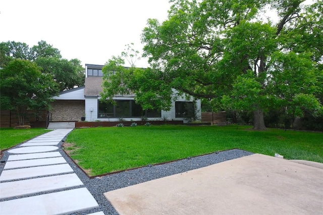 808 Vanguard St, Lakeway, TX 78734 - view of front facade featuring a front lawn and a patio area