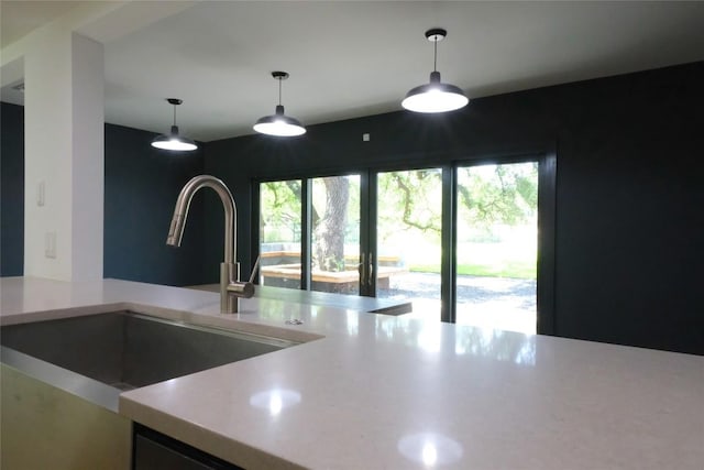 808 Vanguard St, Lakeway, TX 78734 - kitchen with light countertops and hanging light fixtures