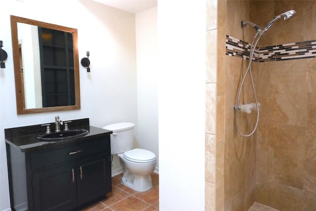 808 Vanguard St, Austin, TX 78734 - bathroom featuring toilet, vanity, a tile shower, and tile patterned floors