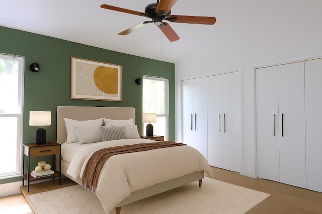808 Vanguard St, Lakeway, TX 78734 - bedroom with two closets, multiple windows, and ceiling fan