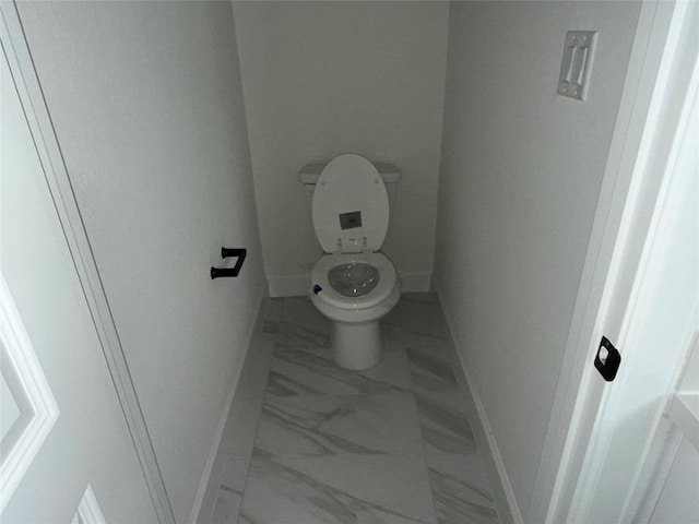 245 Darley Oak Dr, Dripping Springs, TX 78620 - bathroom featuring marble finish flooring, baseboards, and toilet