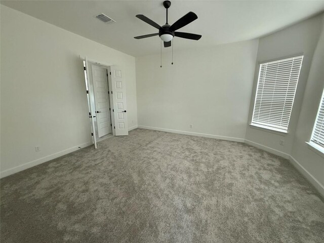 245 Darley Oak Dr, Dripping Springs, TX 78620 - unfurnished bedroom featuring carpet, baseboards, and a ceiling fan
