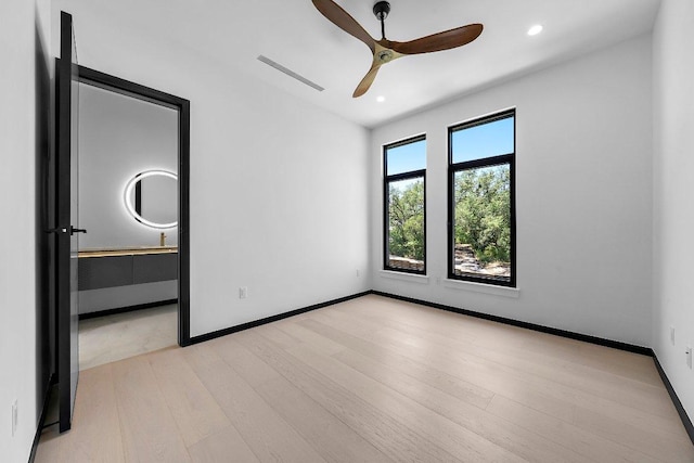 101 S Lake Hills Dr, Austin, TX 78733 - unfurnished bedroom featuring light wood-style flooring, recessed lighting, and ceiling fan
