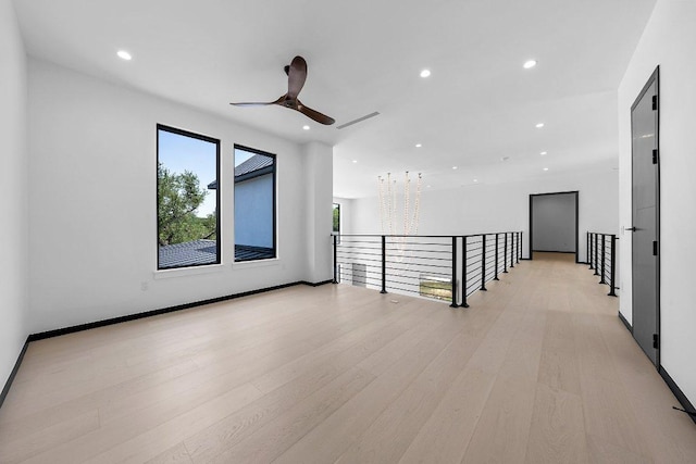 101 S Lake Hills Dr, Austin, TX 78733 - unfurnished room with ceiling fan, recessed lighting, light wood-style floors, and baseboards