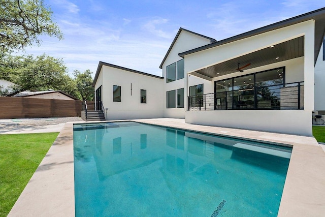 101 S Lake Hills Dr, Austin, TX 78733 - back of property with stucco siding and a ceiling fan