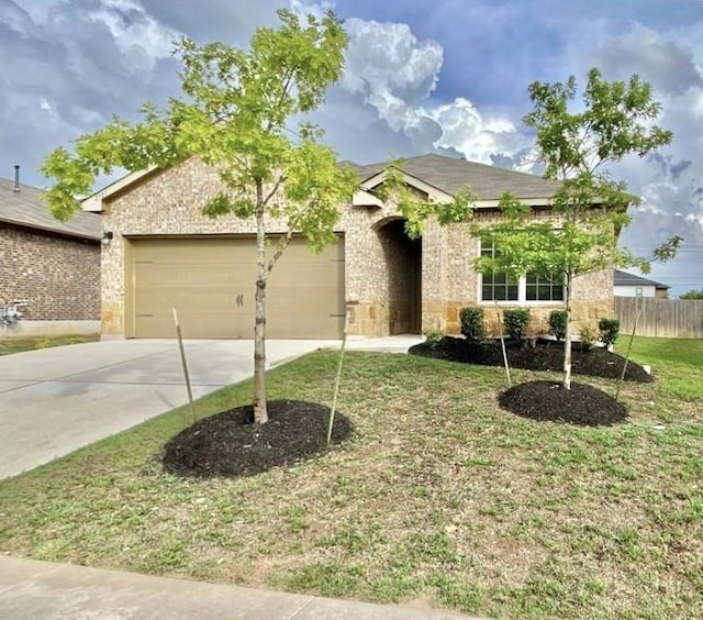 2721 Bridekirk Dr, Round Rock, TX 78664 - view of front of home with a garage, concrete driveway, and stone siding