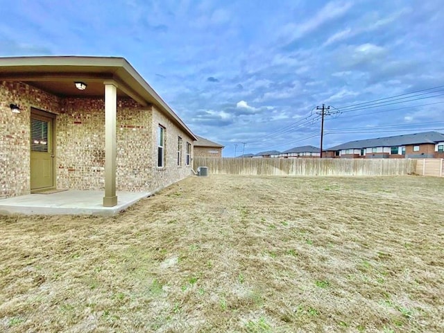 2721 Bridekirk Dr, Round Rock, TX 78664 - view of yard featuring central AC unit and a patio area