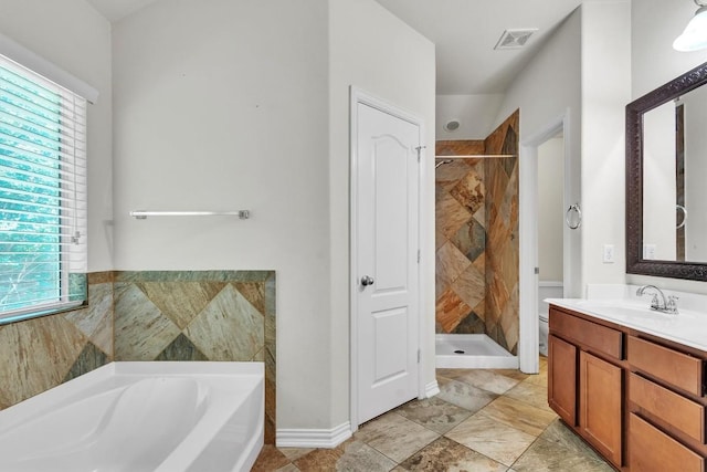 204 Chickadee Ln, Leander, TX 78641 - full bathroom featuring vanity, a shower stall, a bath, and healthy amount of natural light