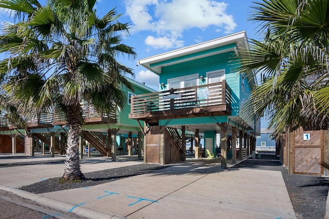 1924 S 11th St Unit 2, Port Aransas, TX 78373 - view of building exterior featuring a carport and stairs