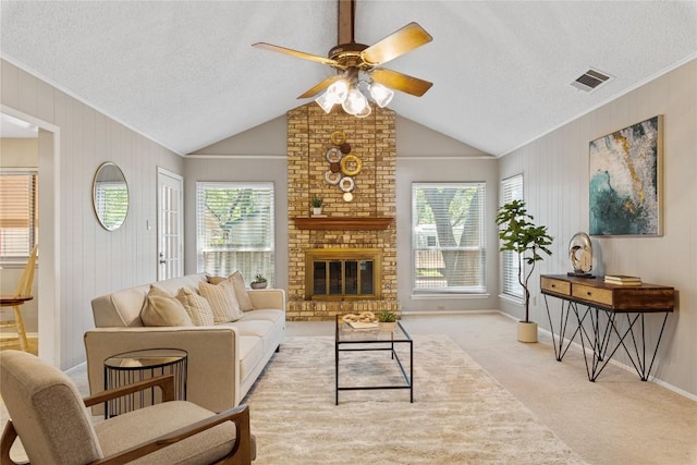 12701 Poquoson Dr, Austin, TX 78727 - living area featuring a ceiling fan, light carpet, vaulted ceiling, a textured ceiling, and ornamental molding