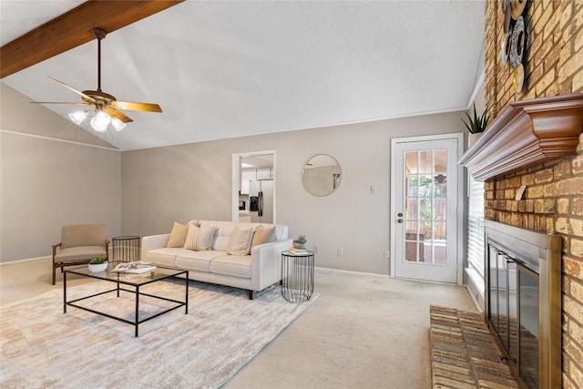12701 Poquoson Dr, Austin, TX 78727 - carpeted living room with ceiling fan, a fireplace, and baseboards