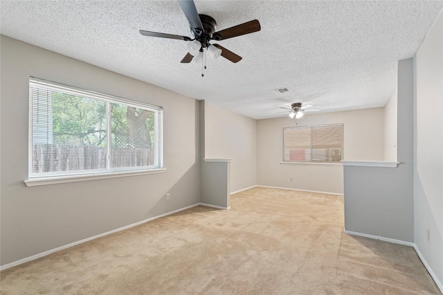 12701 Poquoson Dr, Austin, TX 78727 - unfurnished room featuring ceiling fan, carpet, a textured ceiling, and baseboards