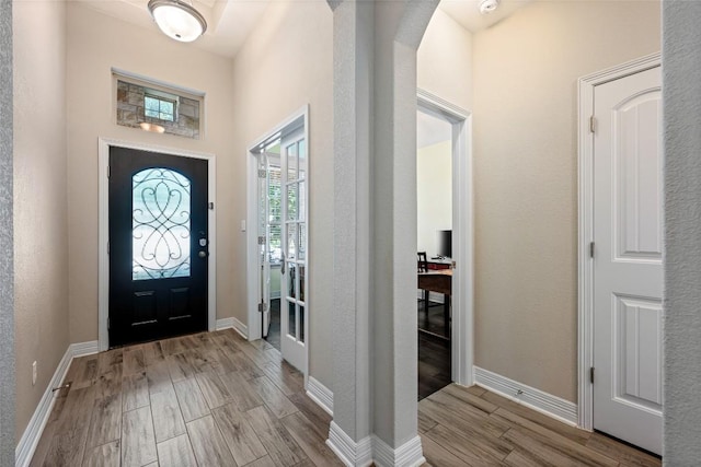 213 Russet Trl, Georgetown, TX 78628 - foyer entrance with wood finished floors, baseboards, and arched walkways