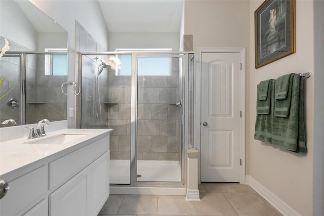 213 Russet Trl, Georgetown, TX 78628 - bathroom with healthy amount of natural light, vanity, a stall shower, and tile patterned flooring