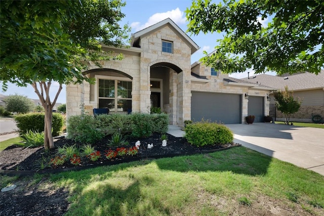 213 Russet Trl, Georgetown, TX 78628 - french provincial home featuring stone siding, an attached garage, concrete driveway, and a front lawn