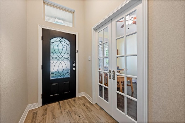 213 Russet Trl, Georgetown, TX 78628 - foyer entrance featuring french doors, light wood-type flooring, and baseboards