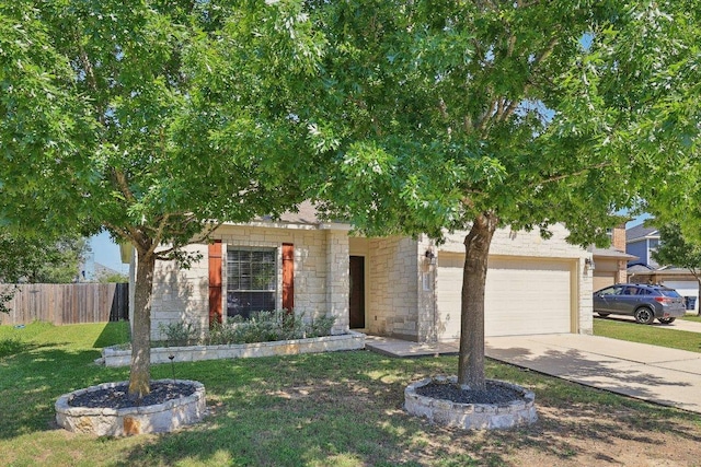 1207 Tricia Cv, Hutto, TX 78634 - view of property hidden behind natural elements featuring driveway, stone siding, and a garage