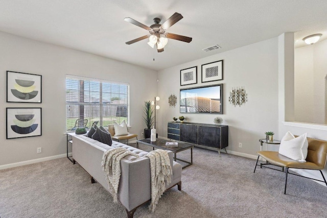 1207 Tricia Cv, Hutto, TX 78634 - carpeted living room featuring a ceiling fan and baseboards