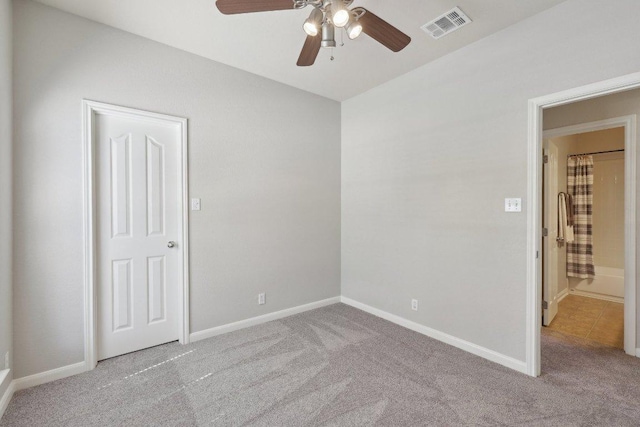 1207 Tricia Cv, Hutto, TX 78634 - unfurnished bedroom featuring carpet, baseboards, and ceiling fan