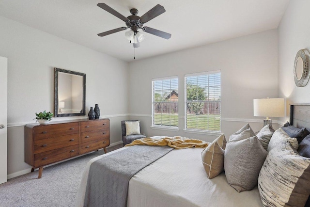 1207 Tricia Cv, Hutto, TX 78634 - carpeted bedroom with baseboards and ceiling fan