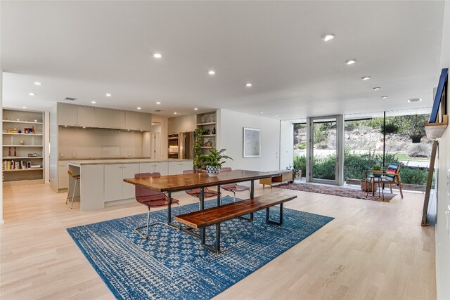 300 Summer Hills Dr, Wimberley, TX 78676 - dining space with light wood-type flooring, expansive windows, and recessed lighting