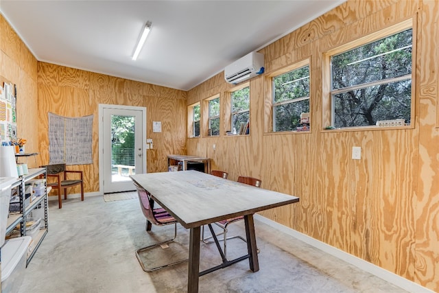 300 Summer Hills Dr, Wimberley, TX 78676 - dining area featuring a wall mounted AC and wood walls