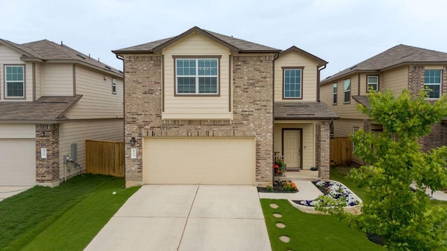 421 Perfect World Loop, Jarrell, TX 76537 - traditional-style house featuring brick siding, driveway, and a garage