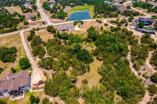 421 Huck Finn Trl, Dripping Springs, TX 78620 - aerial perspective of suburban area with a nearby body of water