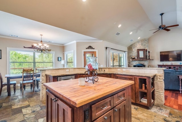 421 Huck Finn Trl, Dripping Springs, TX 78620 - kitchen featuring a kitchen island, plenty of natural light, butcher block counters, a chandelier, and recessed lighting