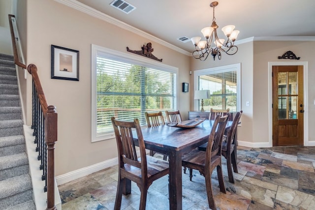 421 Huck Finn Trl, Dripping Springs, TX 78620 - dining room featuring stone tile floors, crown molding, stairs, a chandelier, and baseboards